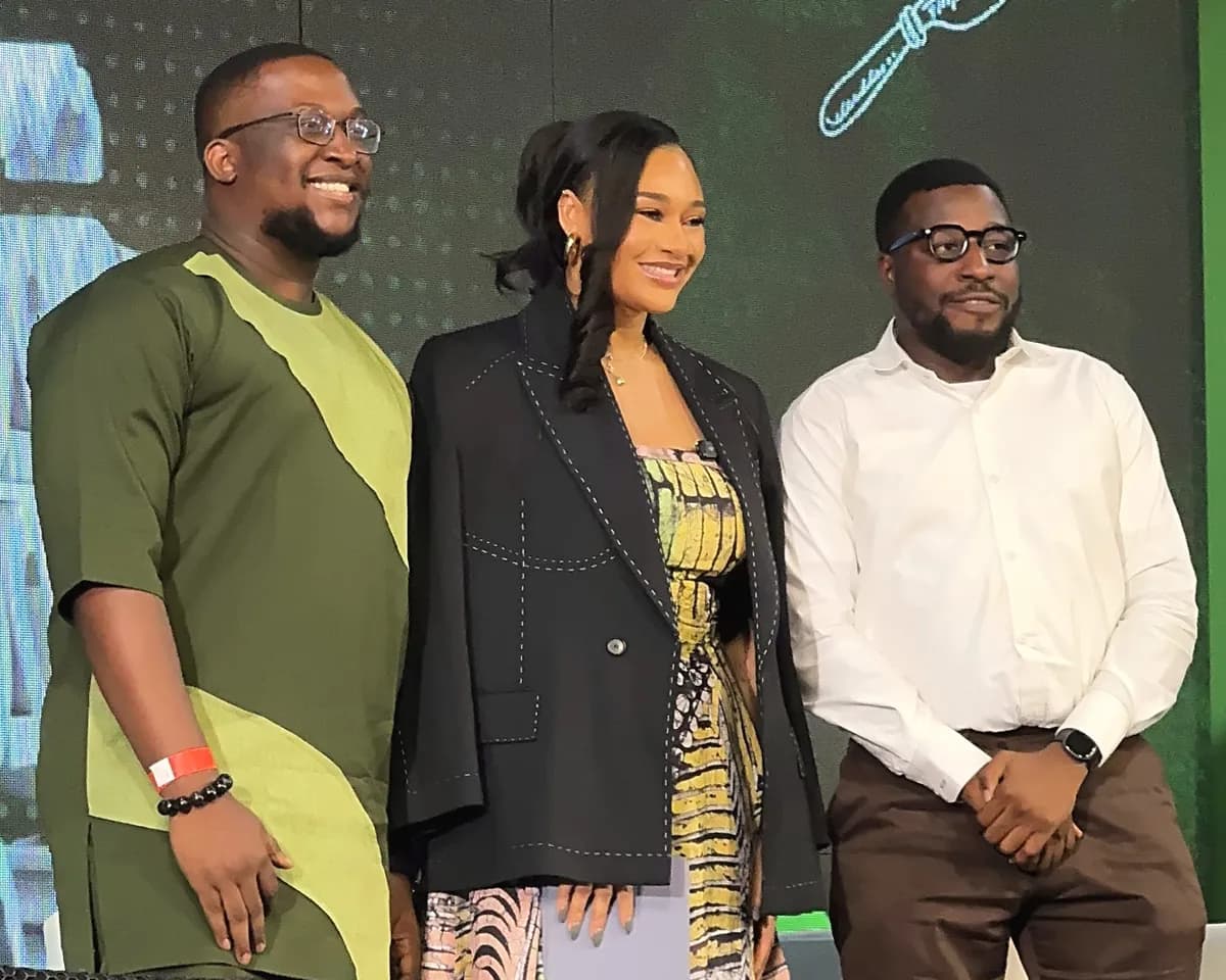 Joshua Udotai with two fellow speakers on stage at Nigeria Food Summit 2026.